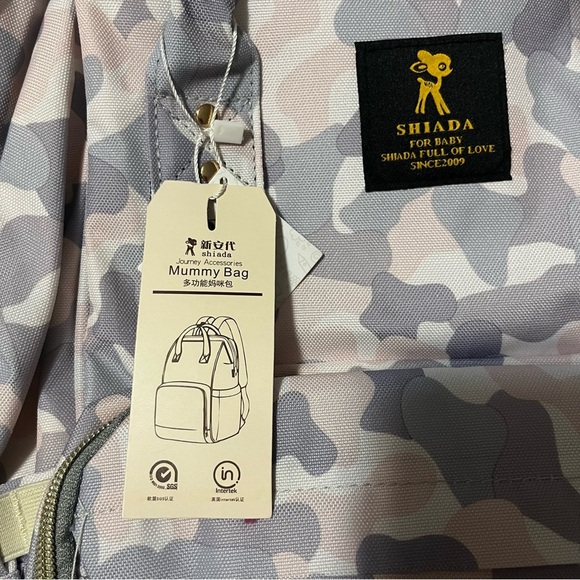 Shiada brand diaper bag backpack with a camouflage pattern in grey, pink, &white - Picture 12 of 15